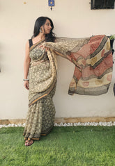 cream and black motif saree with intricate floral and geometrics patterns, featuring a multicolored pallu in earthy tones-handloom cotton.