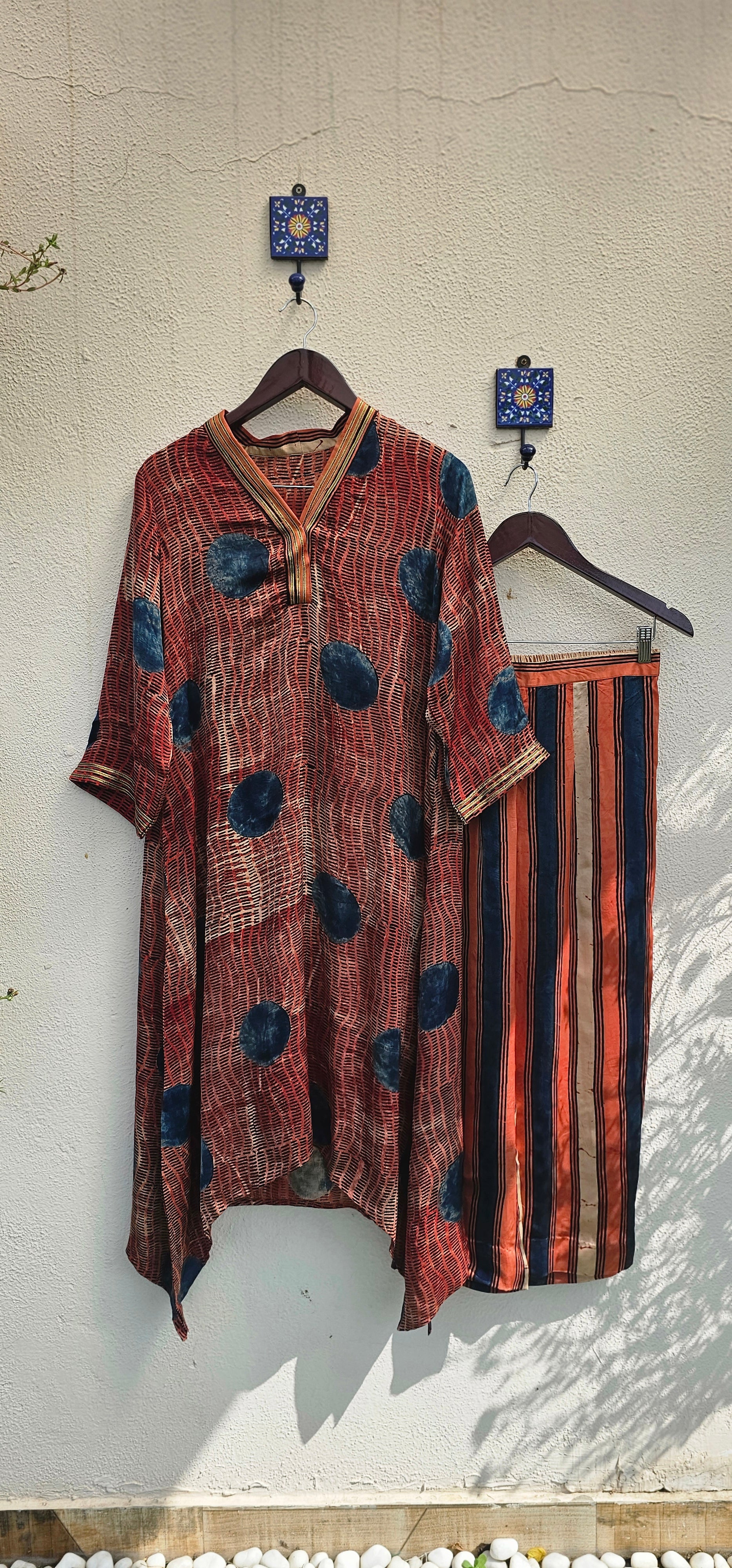 Traditional garment with intricate patterns on a textured surface